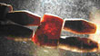Click to enlarge image of amber beads against glass
